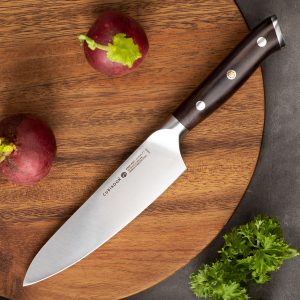 a utility knife on a cutting board