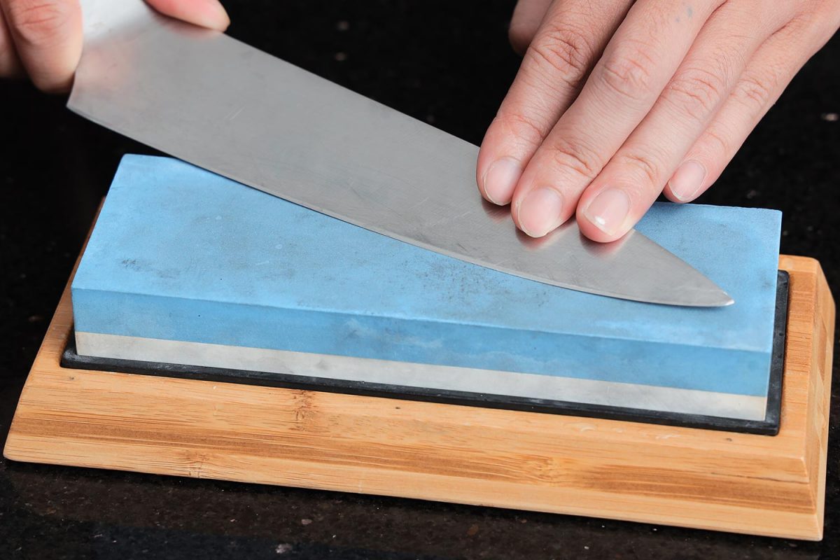 sharpening a knife on a stone